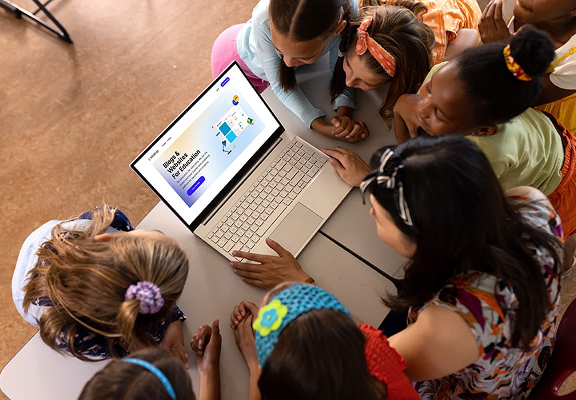 Students surrounding a laptop